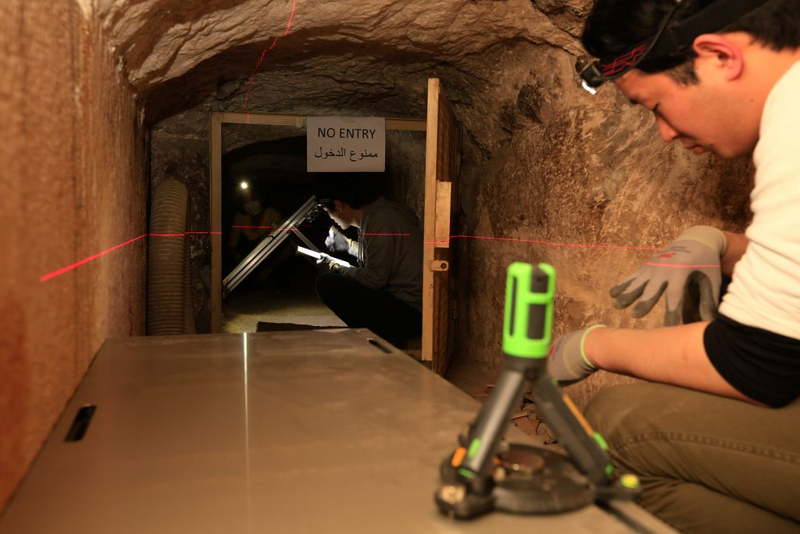 A researcher from Nagoya University at work. This muon detector was positioned within the Queen’s Chamber. (Image: ScanPyramids Mission)